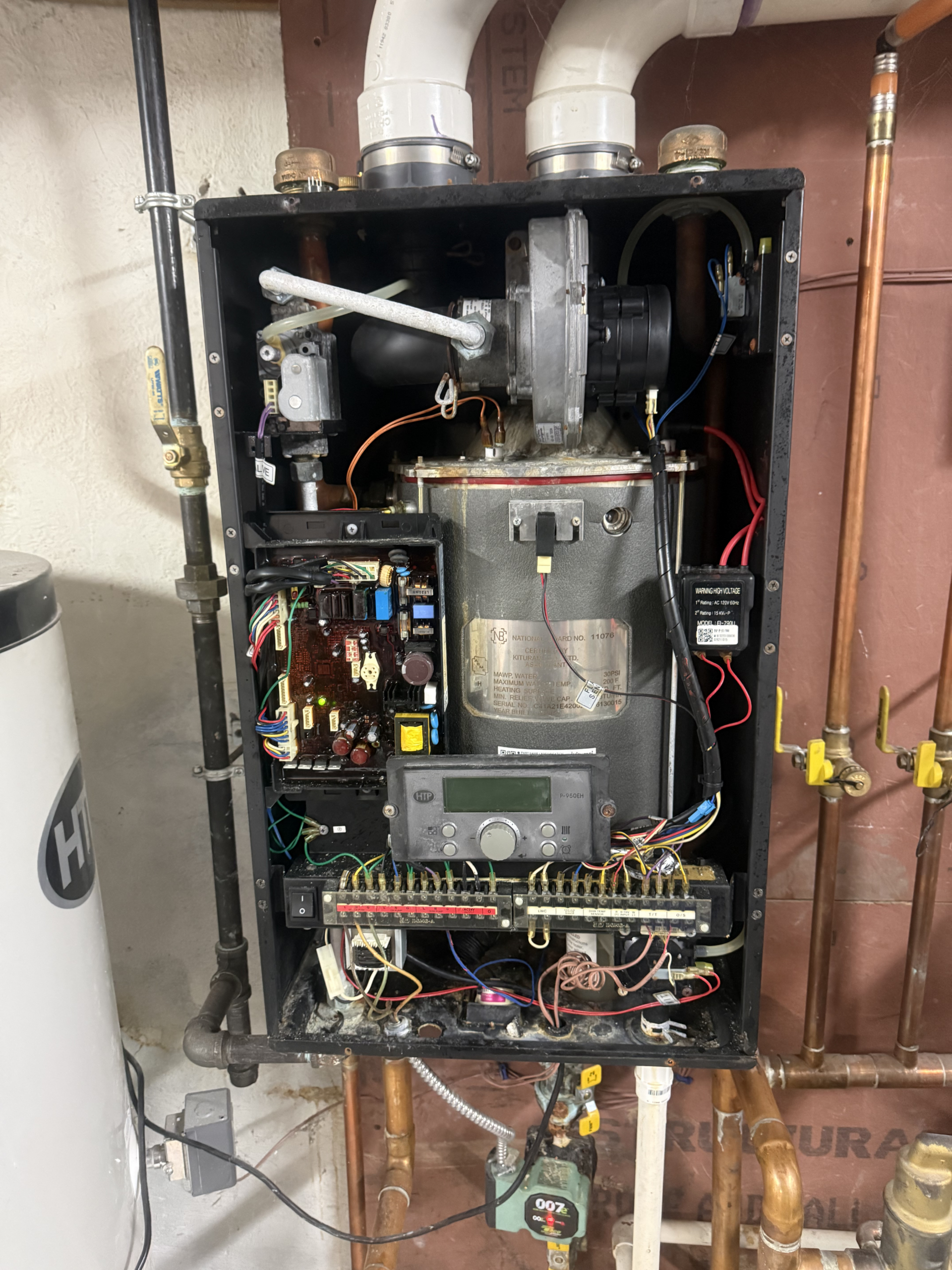 HVAC boiler undergoing professional maintenance.